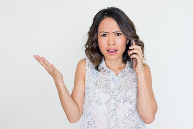 Angry Young Asian Lady Talking on Phone