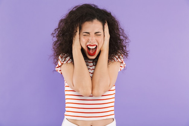 Angry young casual woman screaming