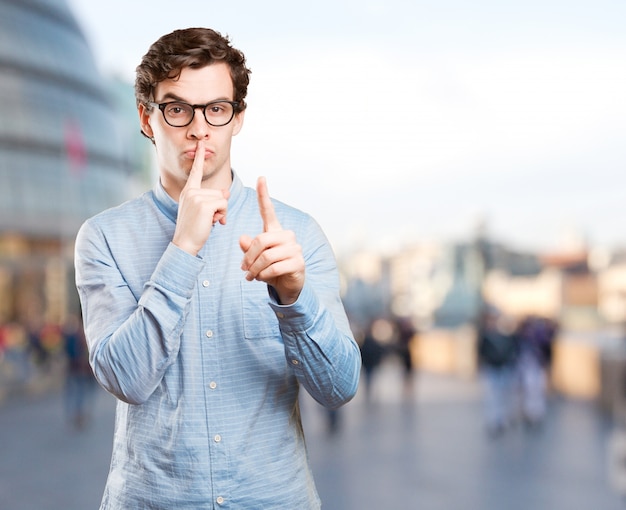 Angry young man asking for silence