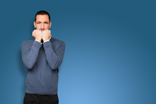 Angry young man posing isolated