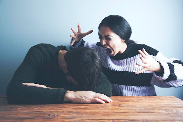 Angry young woman arguing with man