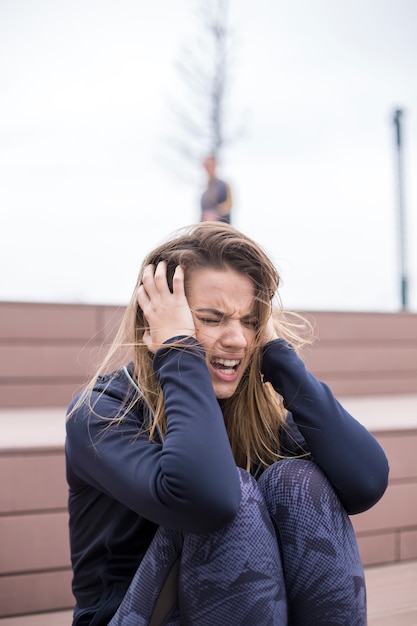 Angry young woman at outdoor