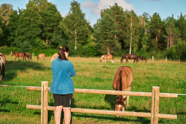 Animal Therapy in Nature Girl and Horse Enjoying a Summer Day Young Girl and Horse in Meadow