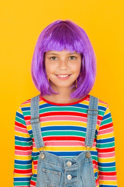 Anime fan Cosplay kids party Child cute cosplayer Cosplay outfit Otaku girl in wig smiling on yellow background Cosplay character concept Culture hobby and entertainment Happy childhood