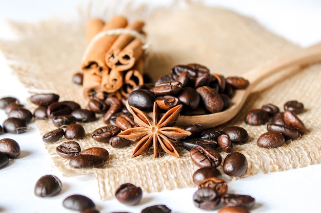 Anise stars and cinnamon on roasted coffee beans.selectiv focus .food