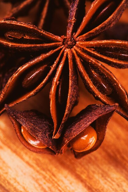 Anise stars on a wooden background