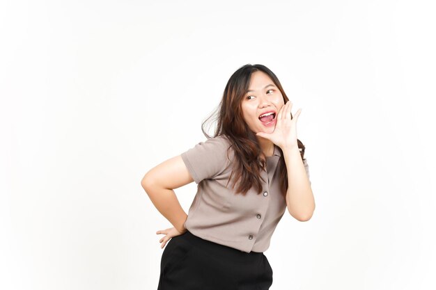 Announcement with hands over mouth Of Beautiful Asian Woman Isolated On White Background