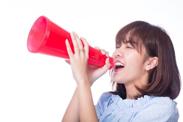 Photo announcement ,young woman holding red bullhorn for announ information with white background.