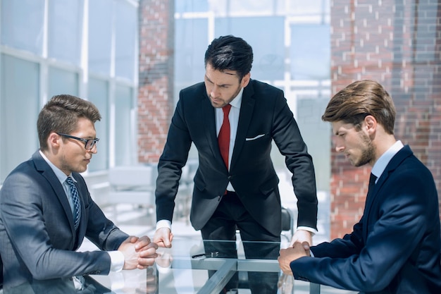 Annoyed businessman talking to employees workers the concept of labor relations