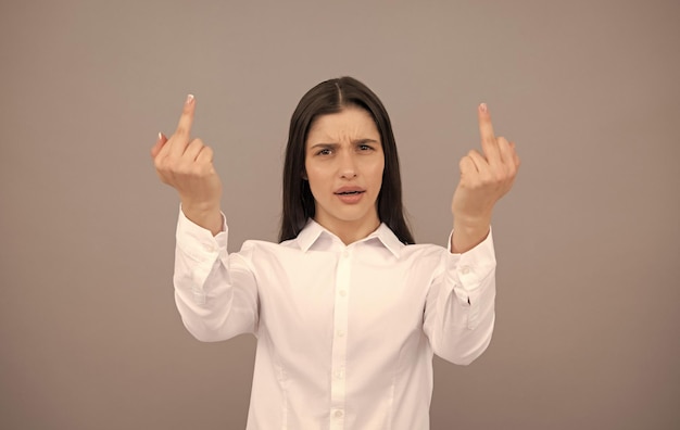 Annoyed woman show middle finger expressing disrespect angry\
bad girl rude aggressive hands gesturing sign avoid haters being\
independent finger gesture nonverbal communication middle\
fingers