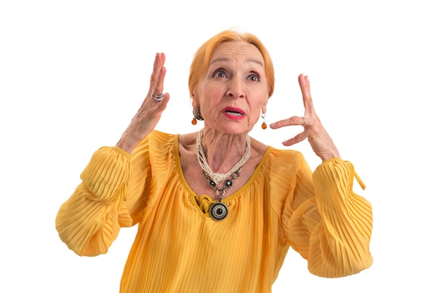 Annoyed woman on white background stressed senior lady waste of nerves