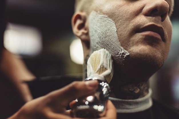 Anonymous barber shaving client