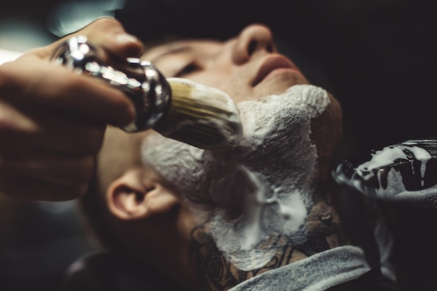 Anonymous barber shaving client