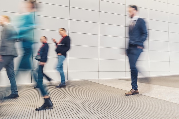 anonymous business pedestrian rushing in a floor. ideal for websites and magazines layouts