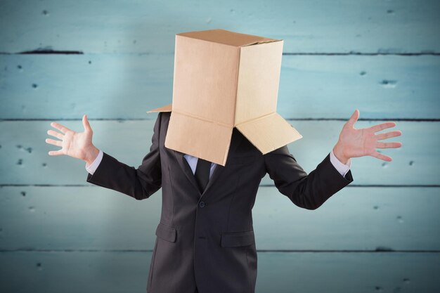 Anonymous businessman with hands out against painted blue wooden planks