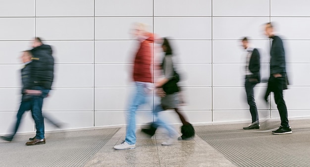 anonymous rowd of blurred people in floor