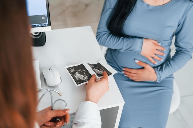 Another consultation Pregnant woman is in the clinic in cabinet and have health check