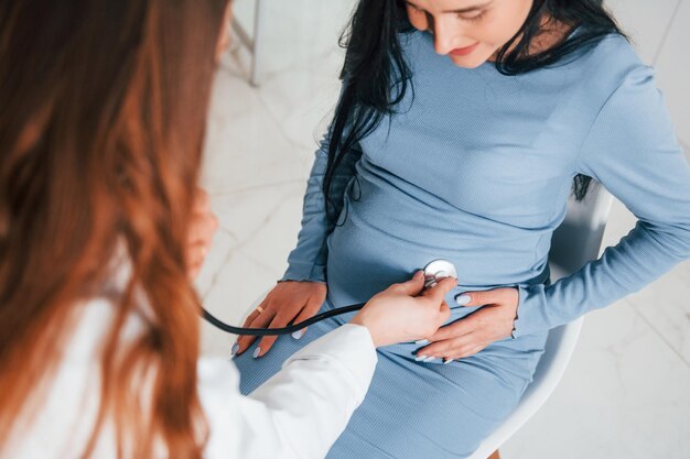 Another consultation Pregnant woman is in the clinic in cabinet and have health check