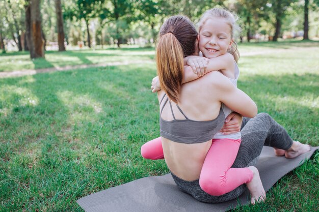 Another picture of happy child hugging her parent.