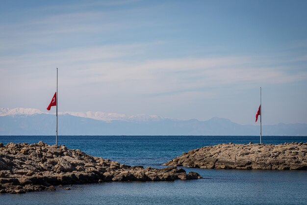 Antalya Turkey February 09 2023 closeup of the Turkish flag at halfmast in honor of the victims of the earthquake