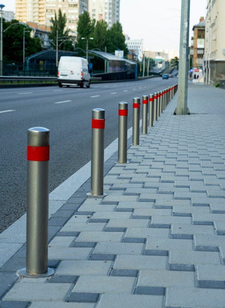 Anti-parking poles on the sidewalk. Parking prohibited