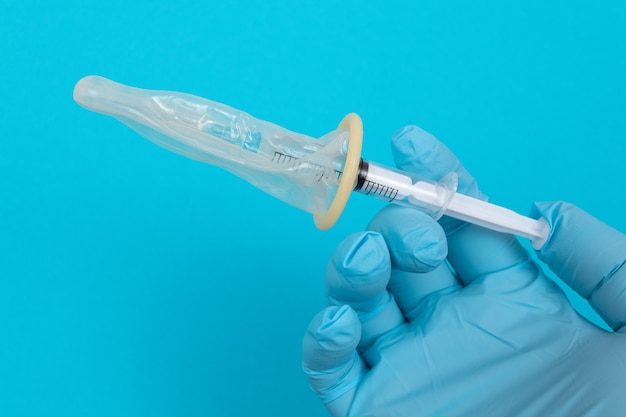 Anti vaccination concept  syringe in a condom