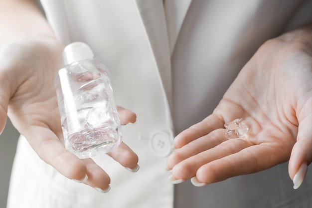 Antibacterial sanitizer gel on woman hands. Hygiene concept. Prevent the spread of germs and bacteria and avoid infections corona virus.