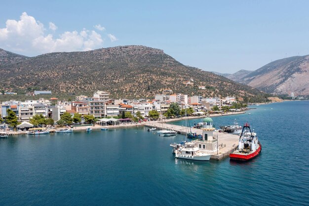 Antikyra Greece aerial drone view Coastal village and boats in Boeotia