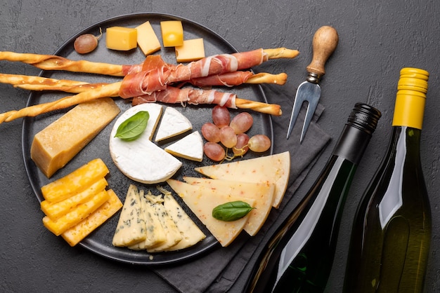 Antipasto board with various cheese and snacks