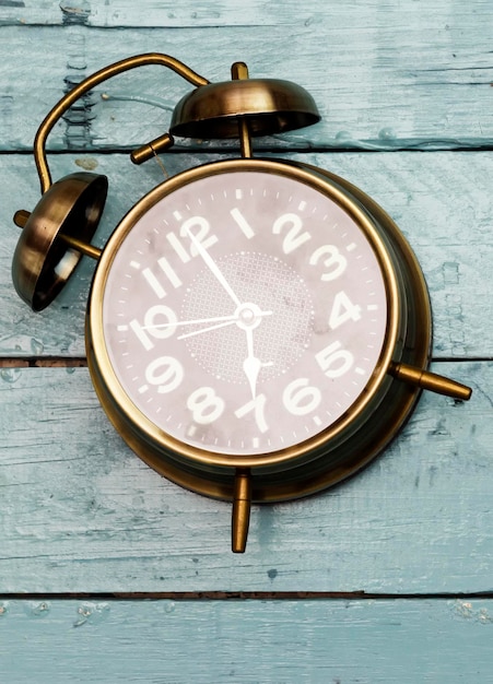 antique alarm 7 o39 Clock on wood table