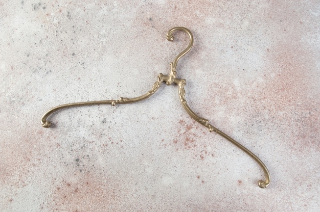 Antique brass clothes hanger