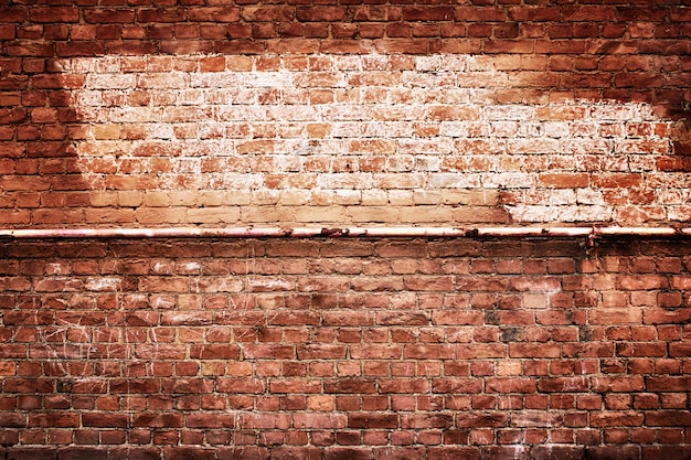 Antique brick wall vintage texture of red stone blocks as background