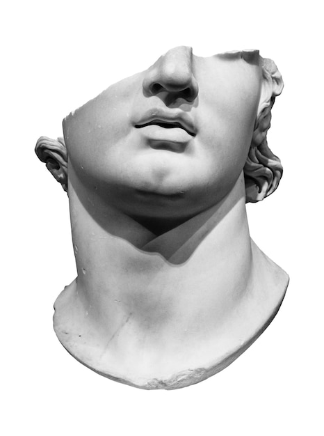 Фото Античная сломанная мраморная голова греческого юноши