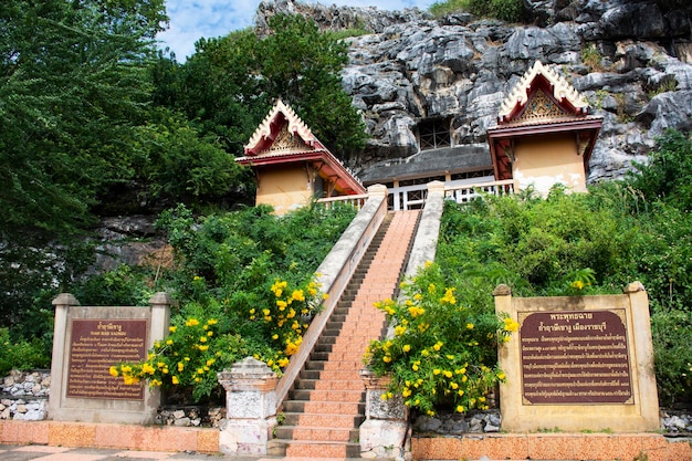 Antique building stair of Wat Tham Khao Ngu temple for thai people travel visit respect praying blessing holy buddha mystical at limestone mountain rock park on November 32022 in Ratchaburi Thailand