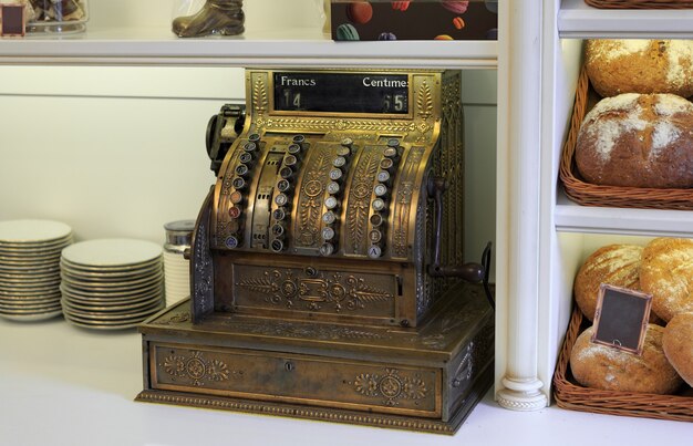 Antique cash register, on a shop window