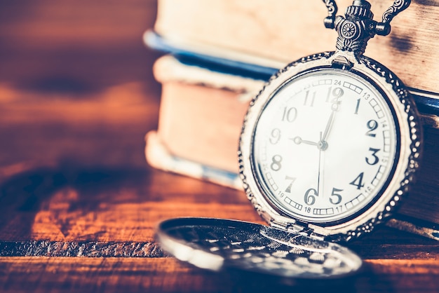 Antique clock handles placed on the wood floor - vintage style.