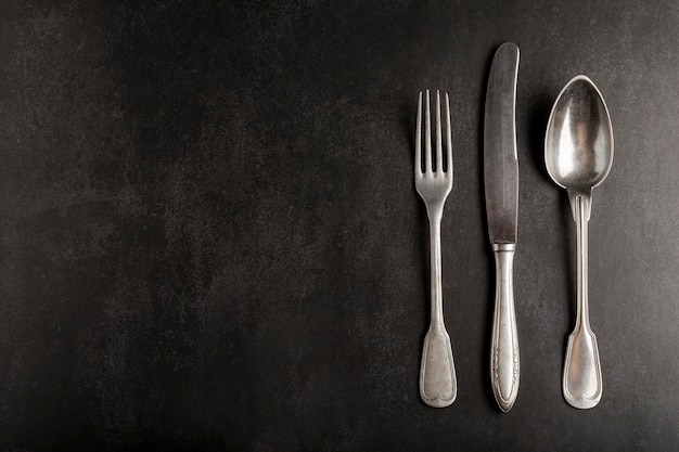 Antique cutlery on the table Vintage cutlery