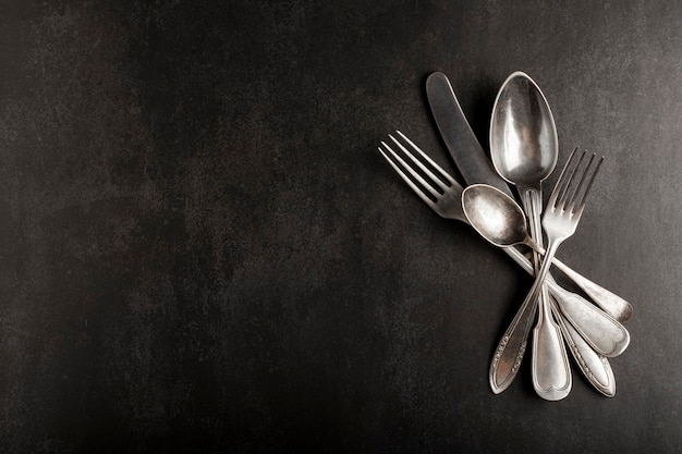 Antique cutlery on the table Vintage cutlery