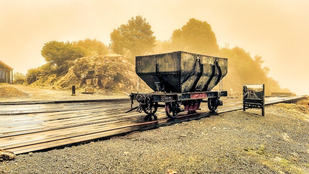 Photo antique historic coal carriage at denniston mine