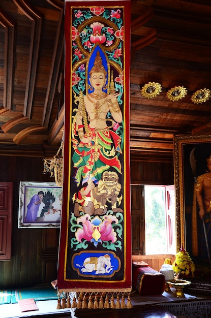 Antique image angel and ancient picture deity lanna style for thai people travelers travel visit and praying respect at Wat Ming Mueang temple at Chiangrai on February 24 2015 in Chiang Rai Thailand