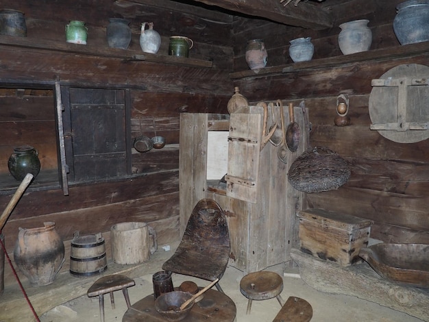 Photo antique kitchen utensils furniture in an old log house trshich loznica serbia shine pots wooden