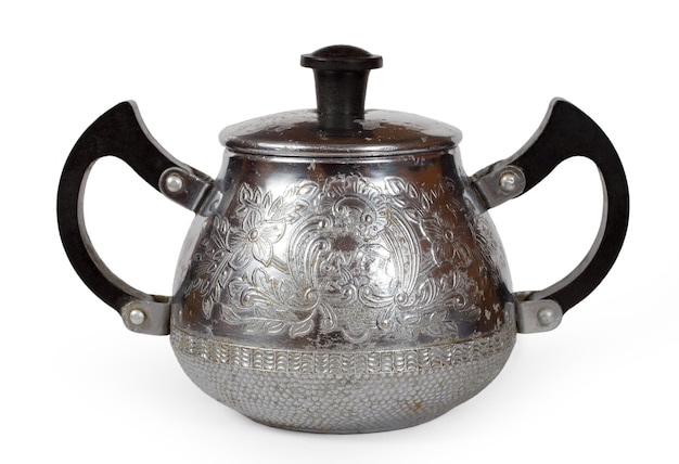 antique metal sugar bowl with patterns on a white background