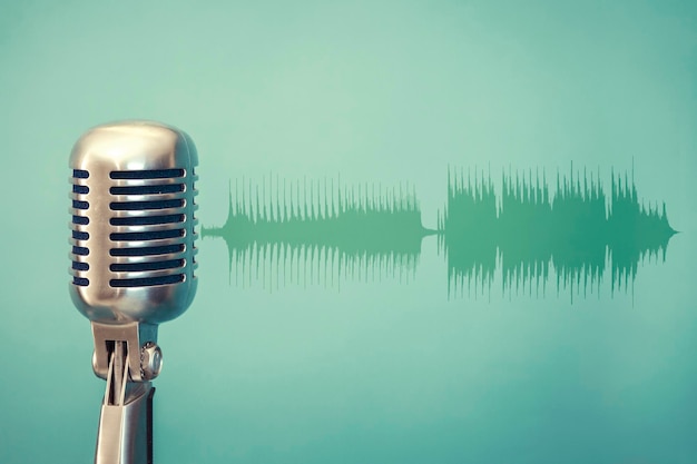 Antique microphone on green background and audio waveform