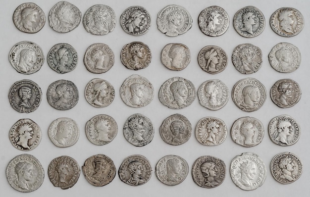 Antique Roman coins laid out in even rows