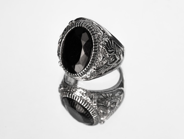 antique silver ring with black stone isolated on white background