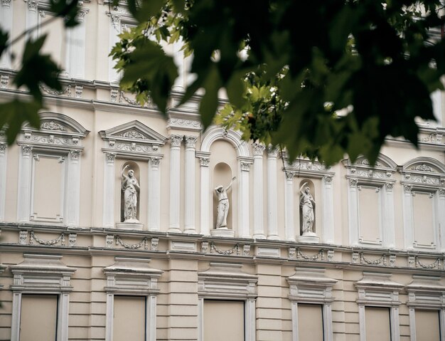 Antique statues on the building facade in Mykolaiv Ukraine