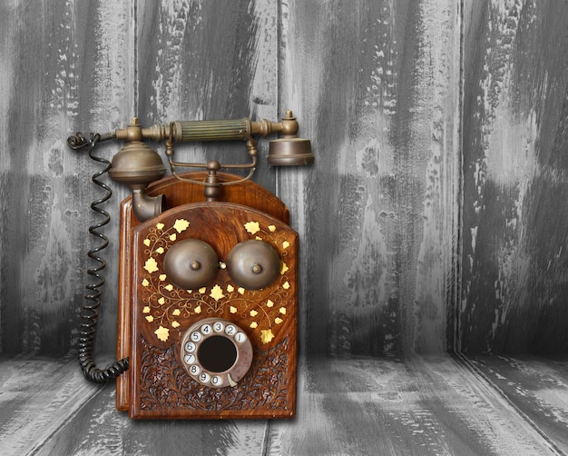 antique telephone on wood