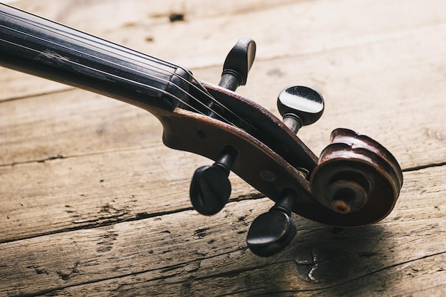 Antique Violin head on a wooden floor