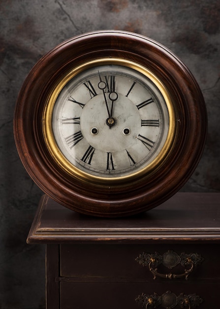 Photo antique wall clocks on a vintage table. pharmaceutical cabinet clocks.