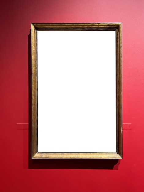 Antique wooden art fair gallery frame on the wall at auction house or museum exhibition blank template with empty white copyspace for mockup design artwork